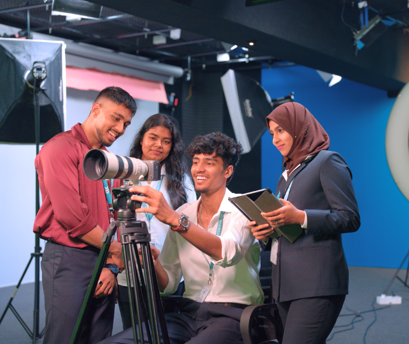 film students learning camera operation during practical training