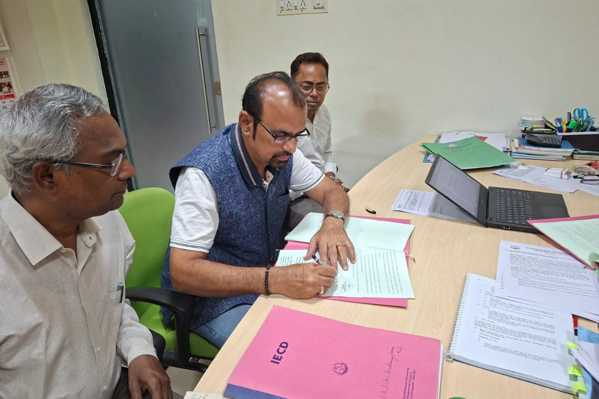 Signing documents for a diploma in film technology course in Chennai at Bharathidasan University, a top film academy in Tamil Nadu.